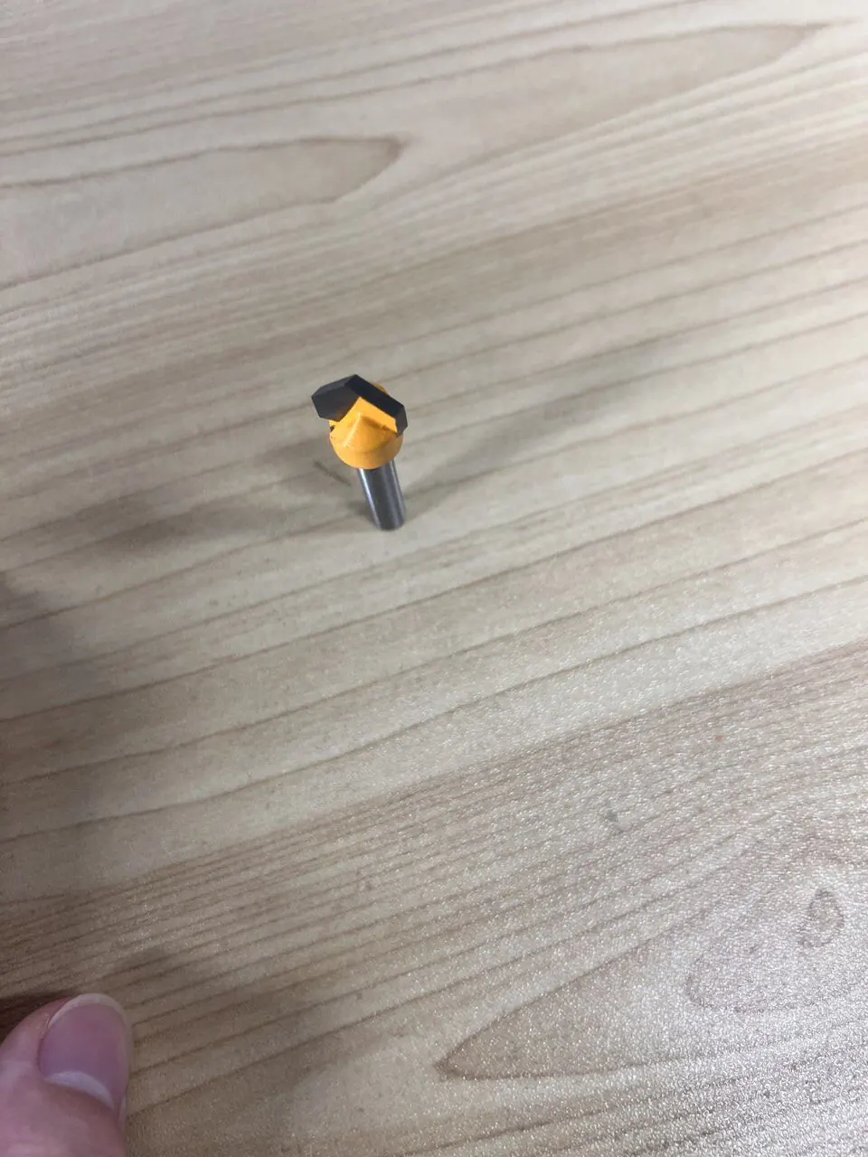 8mm shank 3D V-groove router bit on a wood surface
